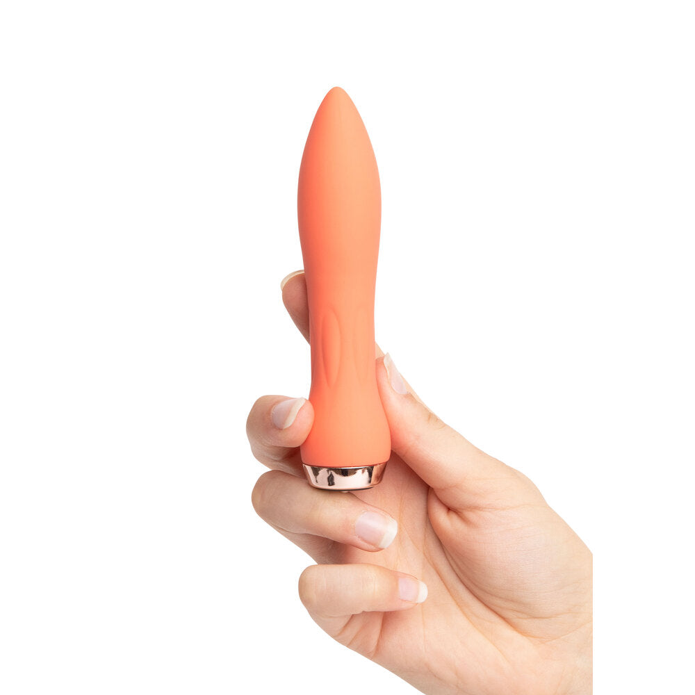 Close-up of a sleek, lipstick-shaped silicone bullet vibrator in a vibrant purple colour, a mini vibrator.