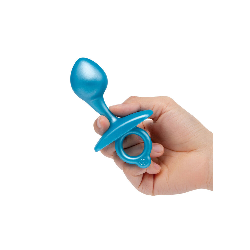 A smooth, bulb-shaped butt plug from B-Vibe, likely silicone and perfect for sensual play.