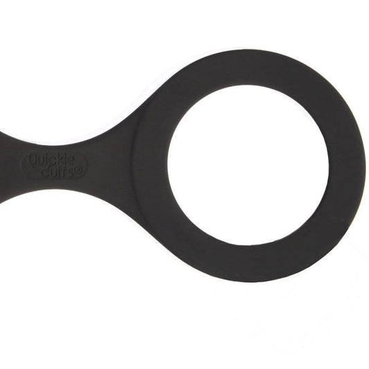 Large, black quickie cuffs handcuffs, perfect for secure restraint play during intimate moments.