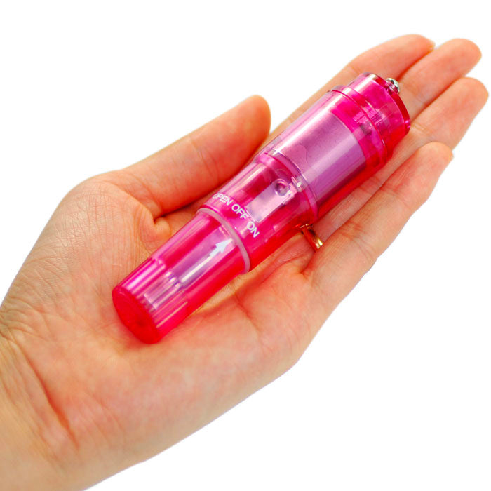 A bright pink, pocket-sized mini vibrator; a discreet and powerful pleasure toy.