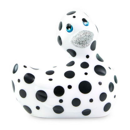 A white, glossy 'i rub my duckie happiness' vibrator, shaped like a cute rubber duck.