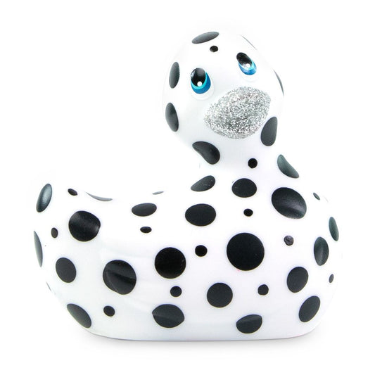 A white, glossy 'i rub my duckie happiness' vibrator, shaped like a cute rubber duck.