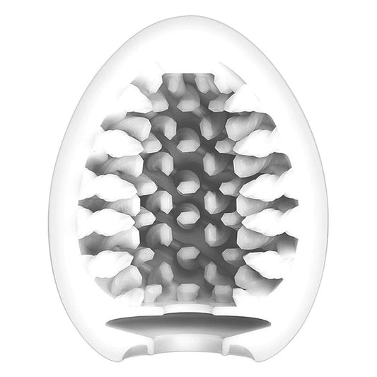 Textured green Tenga Egg masturbator, a reusable and discreet pleasure toy for men.