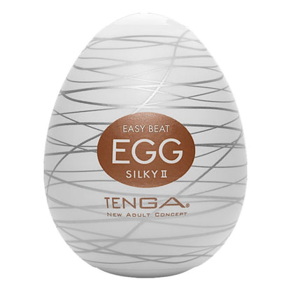 Tenga silky 2 egg masturbator, textured white silicone, providing a pleasurable solo experience.