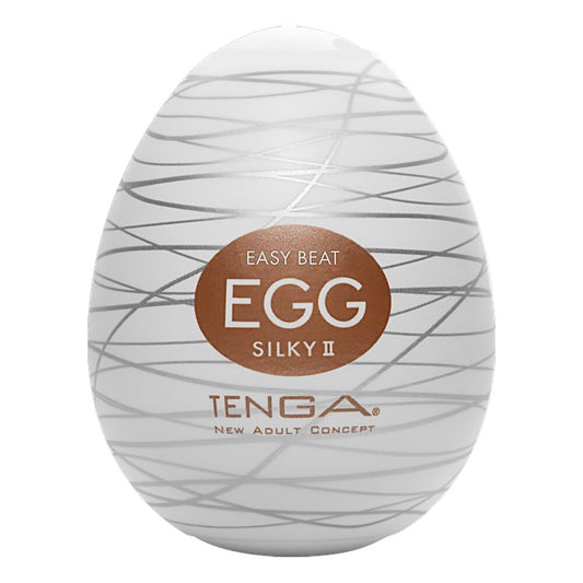 Tenga silky 2 egg masturbator, textured white silicone, providing a pleasurable solo experience.