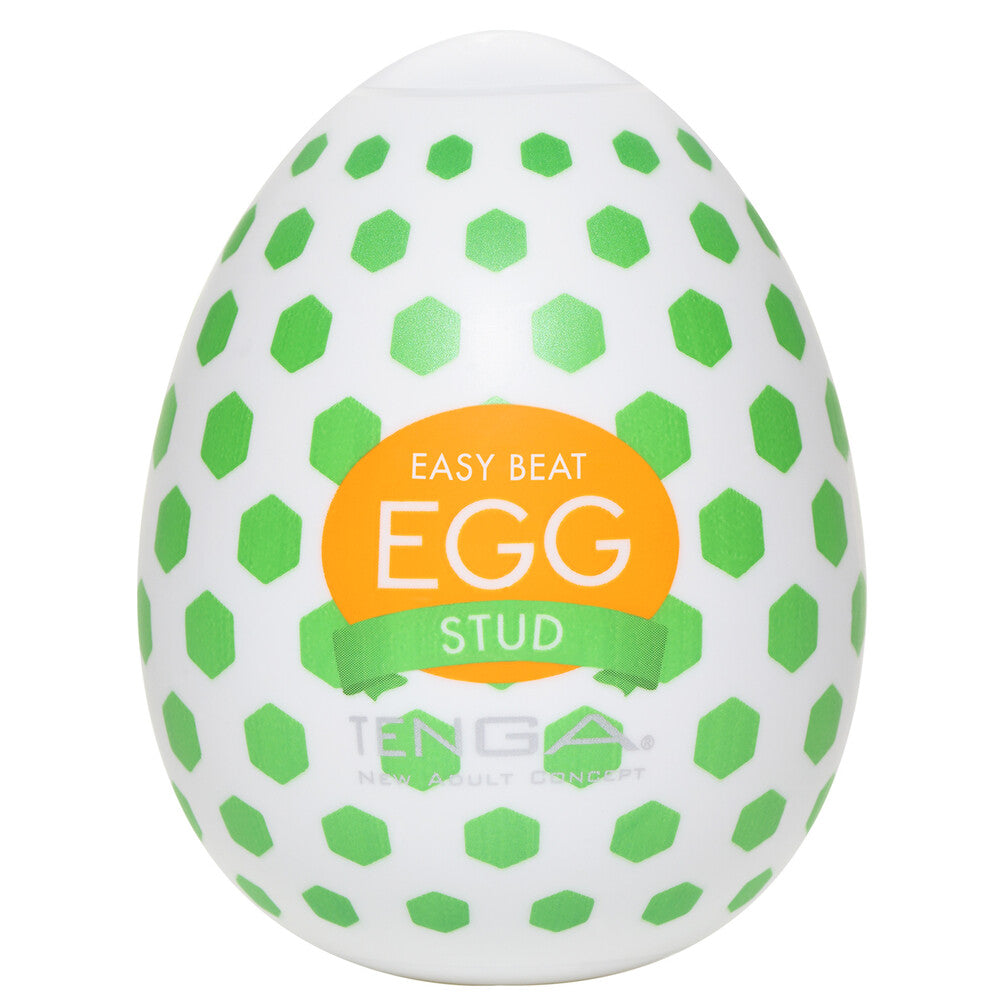 Textured Tenga egg masturbator, white with a repeating stud pattern for tactile pleasure.