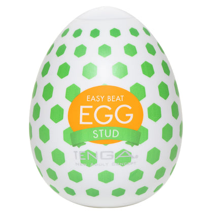 Textured Tenga egg masturbator, white with a repeating stud pattern for tactile pleasure.