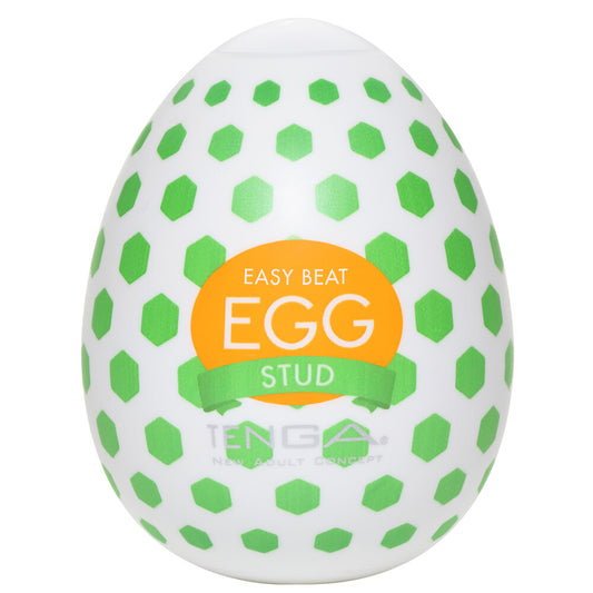 Textured Tenga egg masturbator, white with a repeating stud pattern for tactile pleasure.