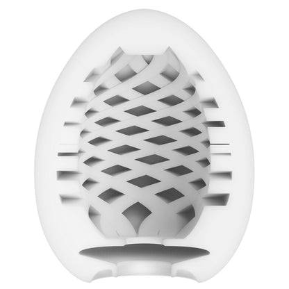 Tenga mesh egg masturbator, textured white and grey soft plastic, intimate pleasure object.