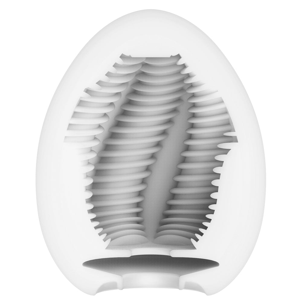 Tenga egg masturbator in a ribbed, textured design, possibly made of soft material.