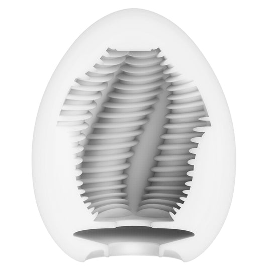 Tenga egg masturbator in a ribbed, textured design, possibly made of soft material.