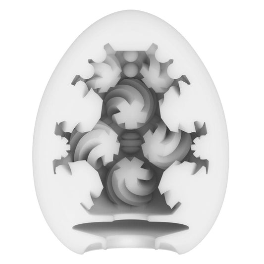 Tenga curl egg masturbator, textured white interior with a flexible, patterned outer shell.