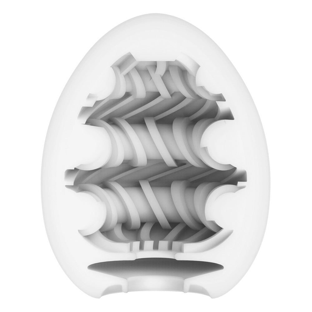 Textured white Tenga Egg masturbator ring, providing pleasure and stimulation, close-up showing the detailed design.