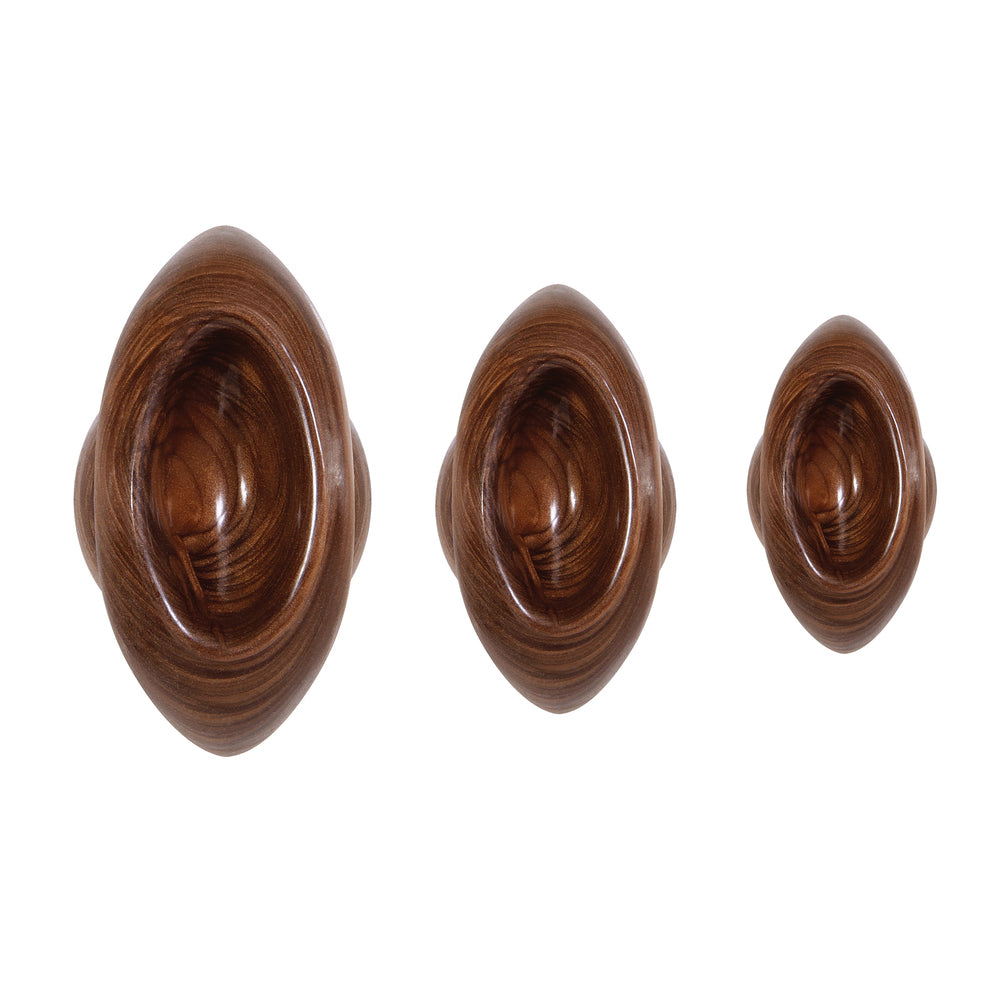 A set of shiny, twisted metal butt plugs from Evolved Sex Toys for anal play.