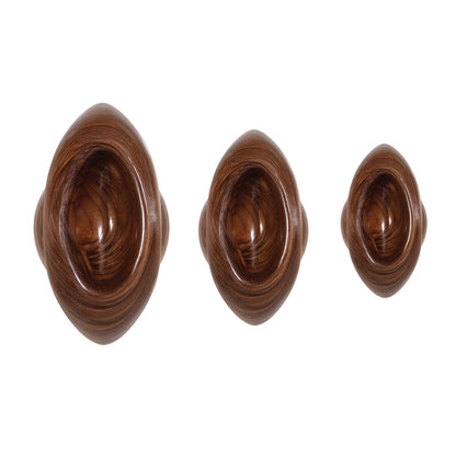 A set of shiny, twisted metal butt plugs from Evolved Sex Toys for anal play.