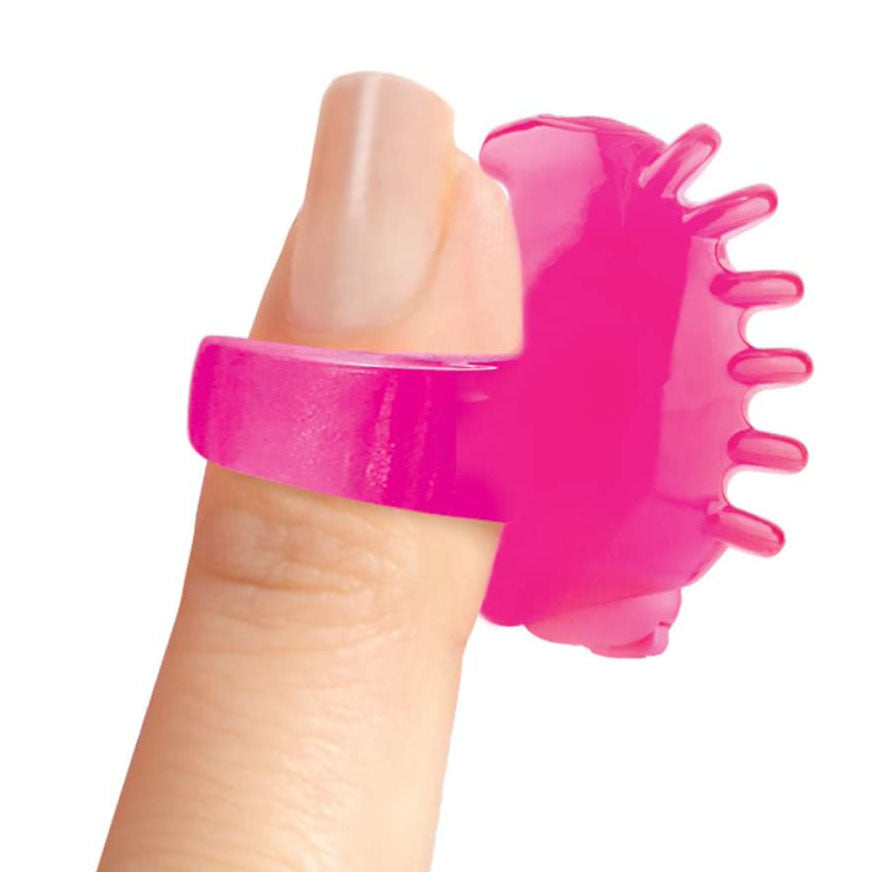 Close-up of a neon pink Screaming O FingO Tips fingertip vibrator for pleasure.