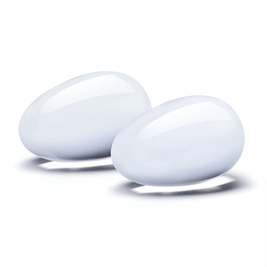 Two clear glass yoni eggs, part of an orgasm balls set from Various Toy Brands.