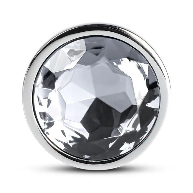 Large metal butt plug with a clear crystal at the base, a shiny finish.