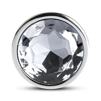 Large metal butt plug with a clear crystal at the base, a shiny finish.