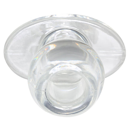 Close-up of a medium-sized clear tunnel plug for ear stretching by Perfect Fit.