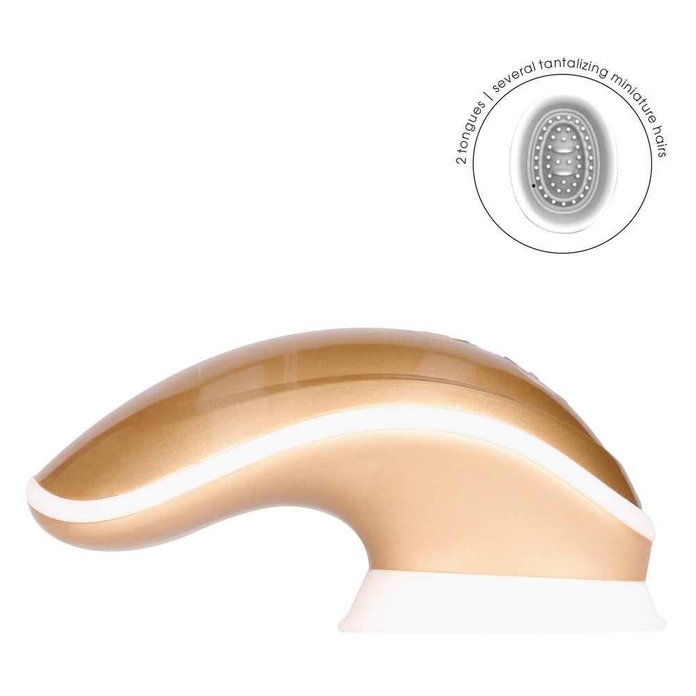 Gold-coloured hands-free clitoral vibrator from Shots Toys with suction base for pleasure.