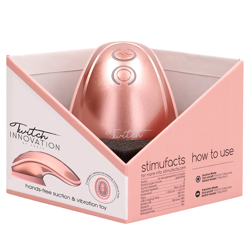 Rose gold hands-free vibrator from Shots Toys, a clitoral stimulator with suction and vibration.