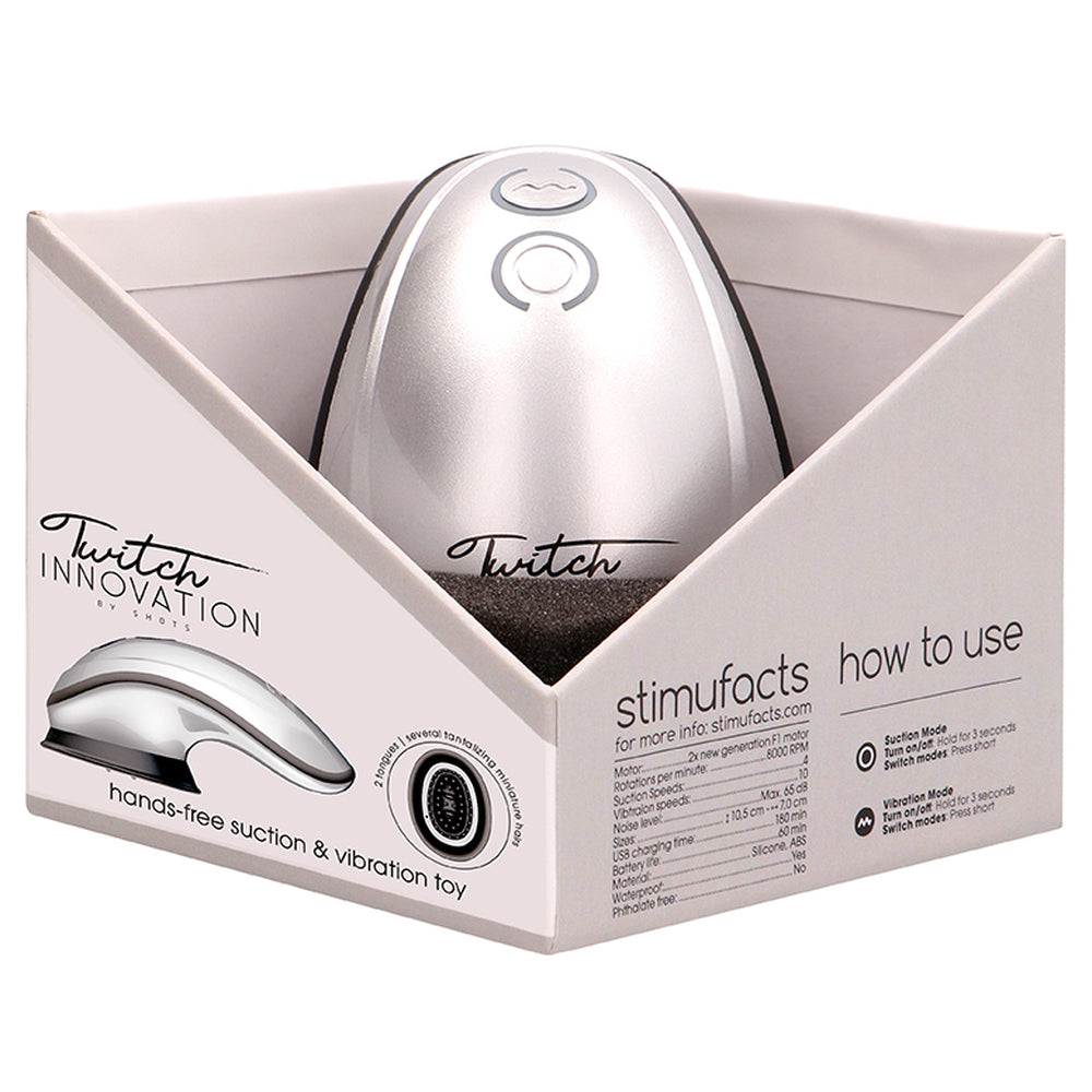 Silver hands-free suction vibrator toy from Shots Toys for clitoral stimulation, close up.