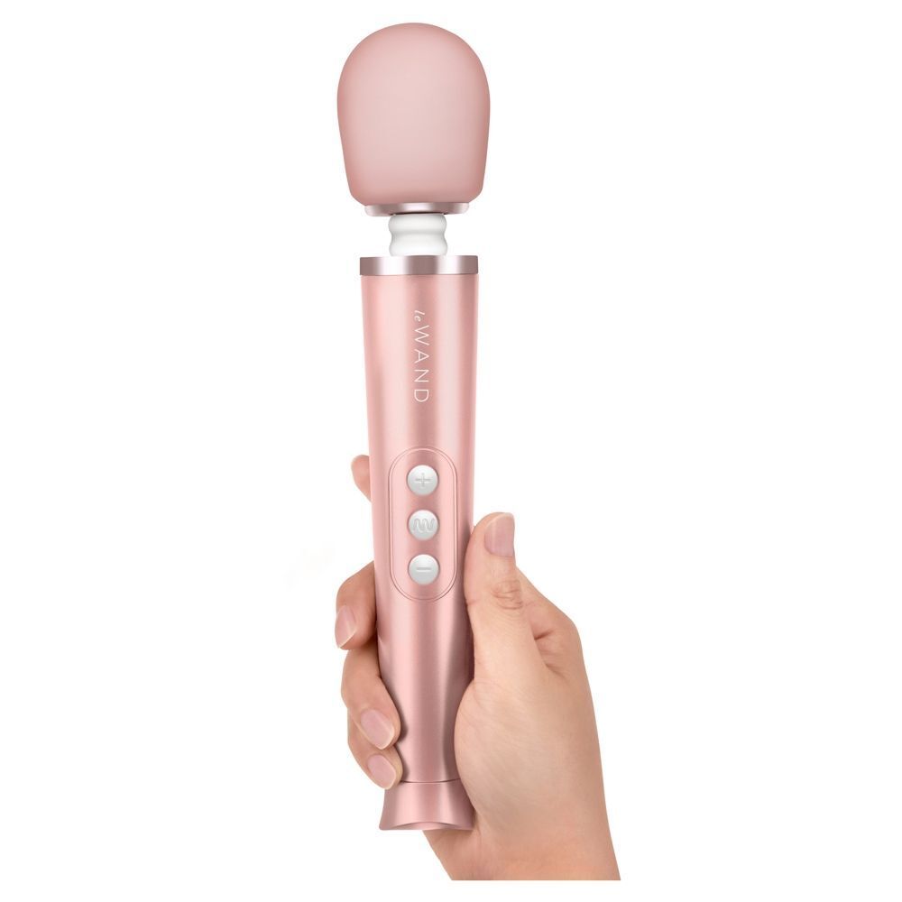 Le Wand petite gold travel rechargeable wand massager, showing its sleek, compact design.