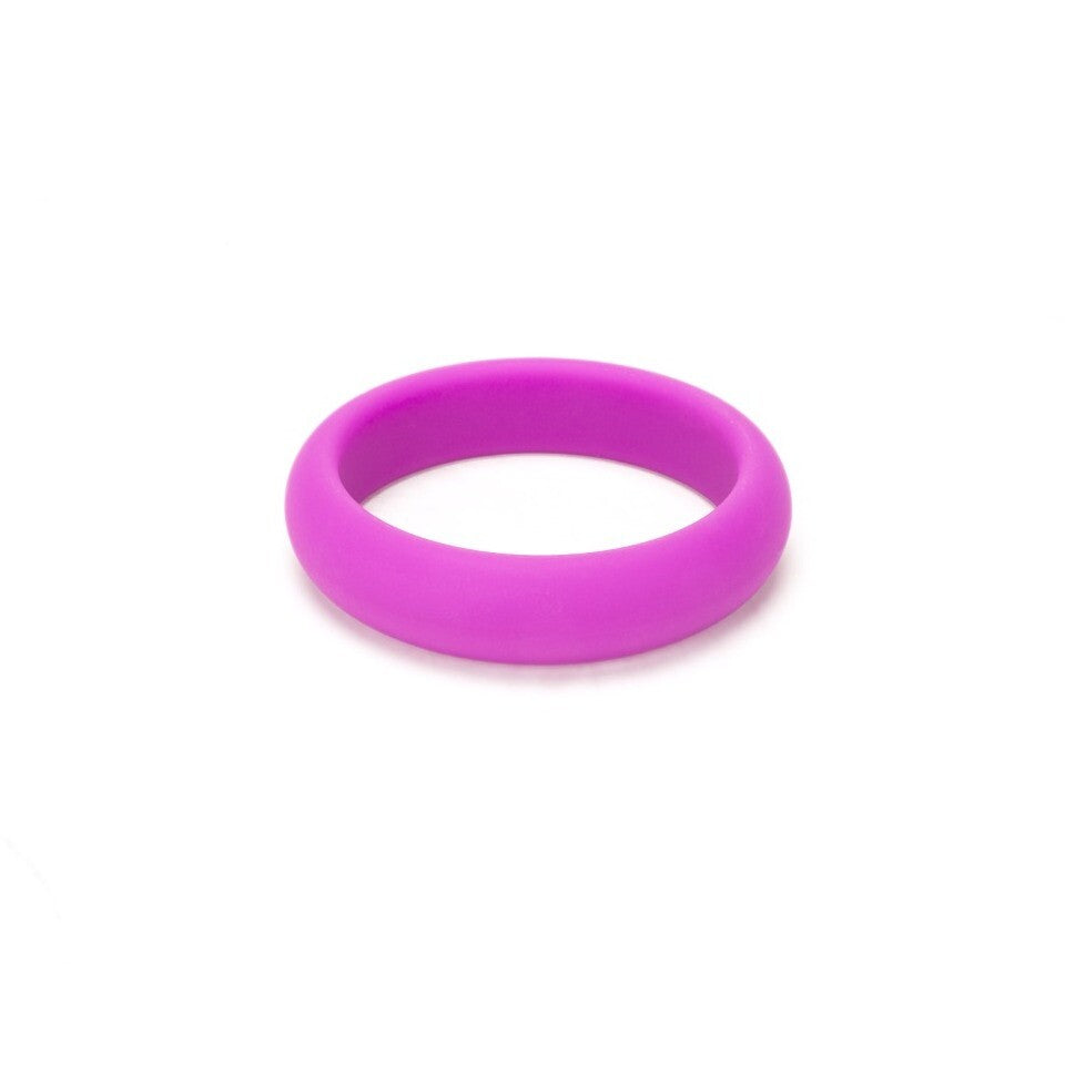 Close-up of a smooth, 50mm wide, grey silicone ring from me you us; a love ring.