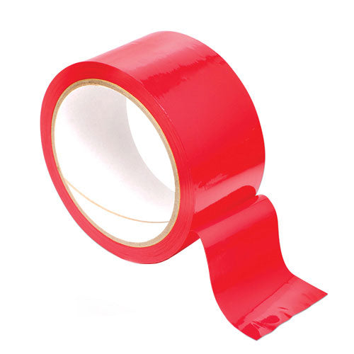 Close-up of bright red bondage tape, a restraint essential, showing its texture and vibrant colour.