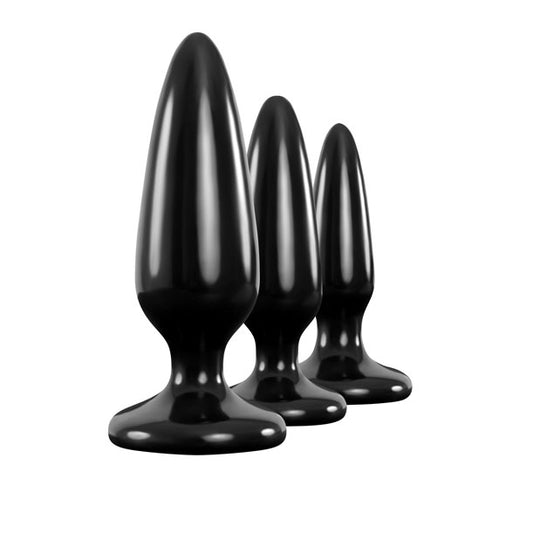 Set of three graduated, smooth, silicone butt plugs for pleasure training. One is red.