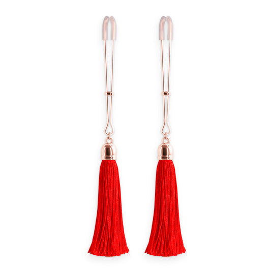 Red tassel nipple clamps from ns novelties: body jewellery for playful sensations.