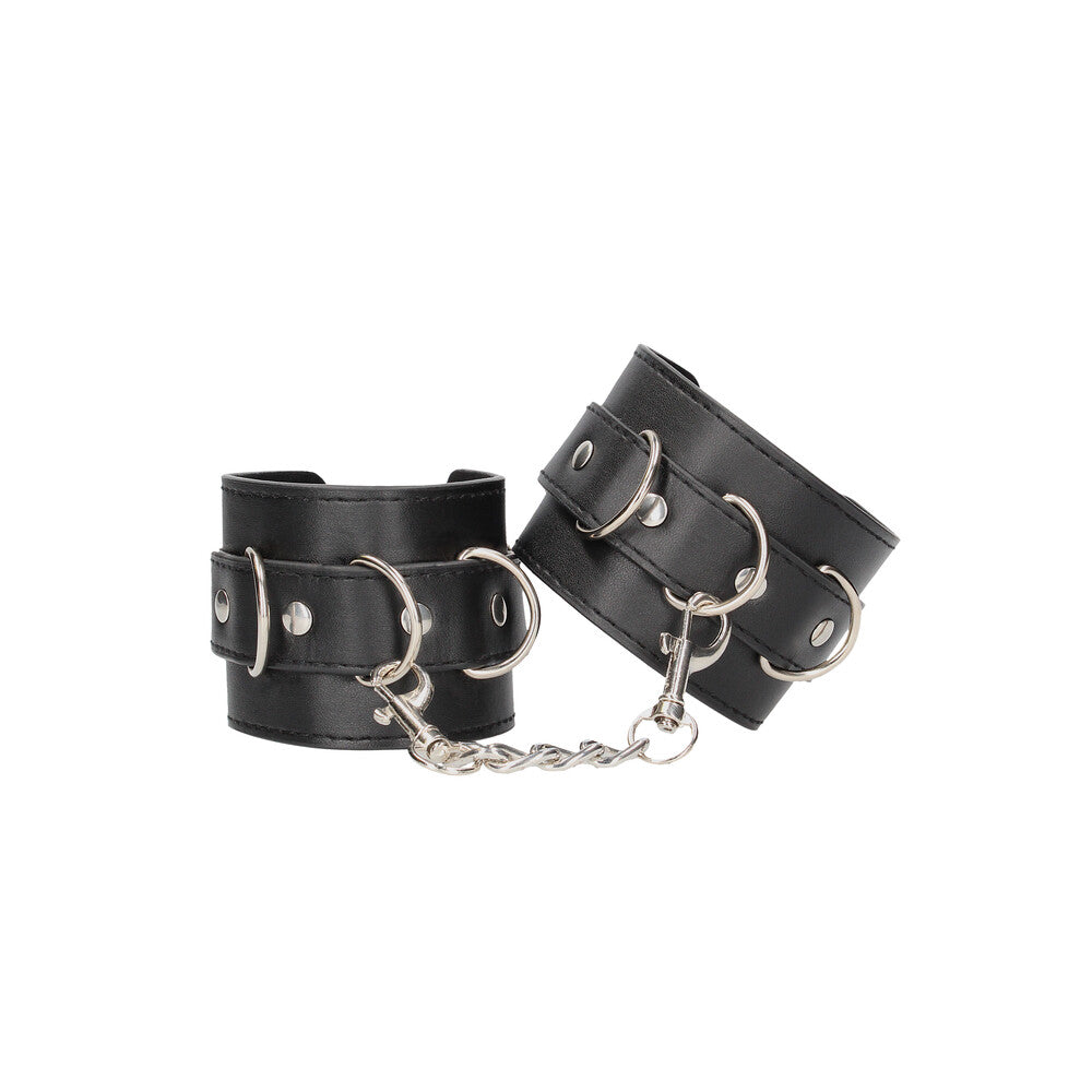 Black leather wrist restraints for bondage play, the 'ouch' cuffs from shots toys.