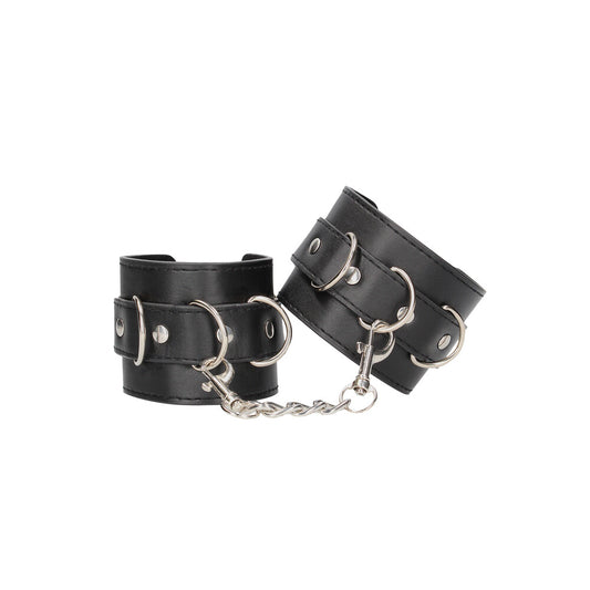 Black leather wrist restraints for bondage play, the 'ouch' cuffs from shots toys.
