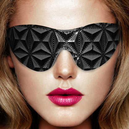 Close-up of a plush, black 'ouch' eye mask for restful sleep, from Shots Toys.