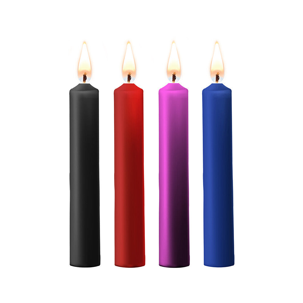 Four small teasing wax candles in assorted colours, perfect for bath and massage.