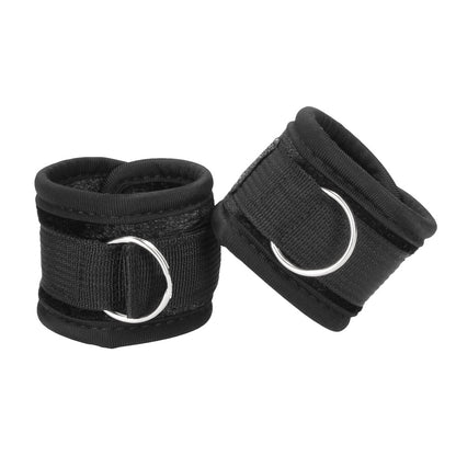 Shots Toys ouch velvet and velcro wrist cuffs in black, a kinky bedroom accessory.