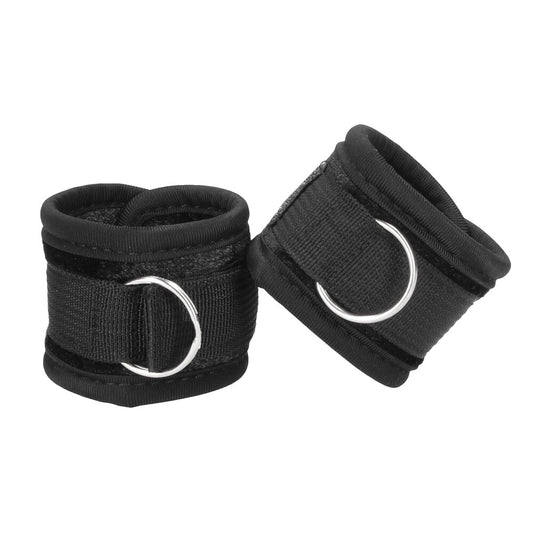 Shots Toys ouch velvet and velcro wrist cuffs in black, a kinky bedroom accessory.