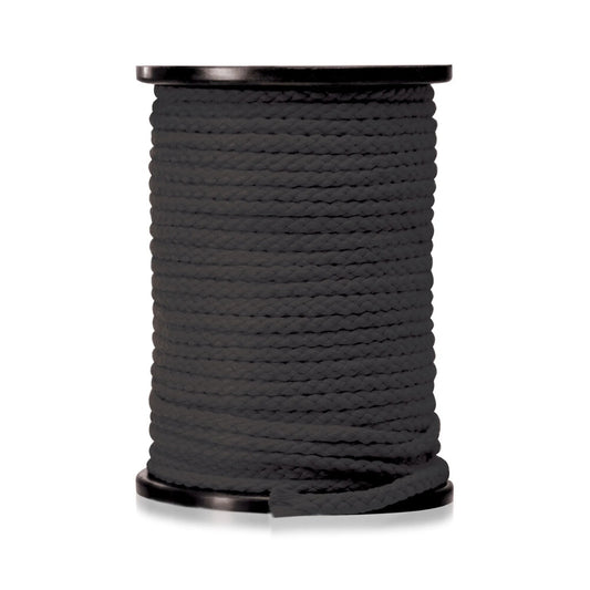 A long length of red bondage rope from the fetish fantasy series, coiled neatly.