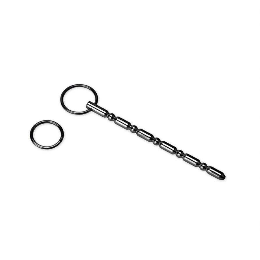Red urethral plug for cock and ball bondage play, made from smooth, medical-grade material.