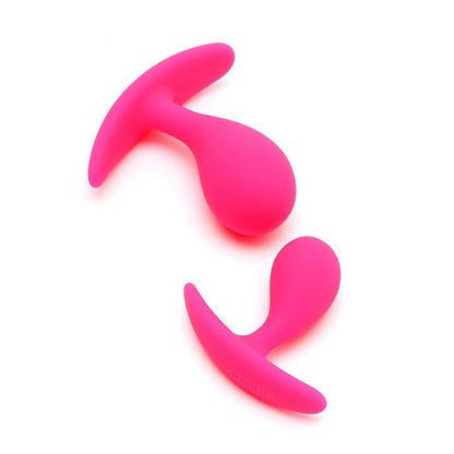 Two pink, smooth silicone anal plugs from Rimba, a set for comfortable exploration.