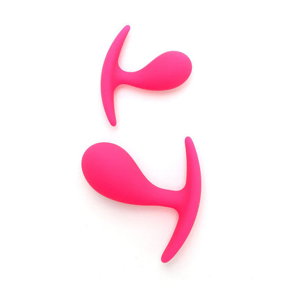 Two graduated pink anal plugs, part of the Rimba Copenhagen set, for intimate play