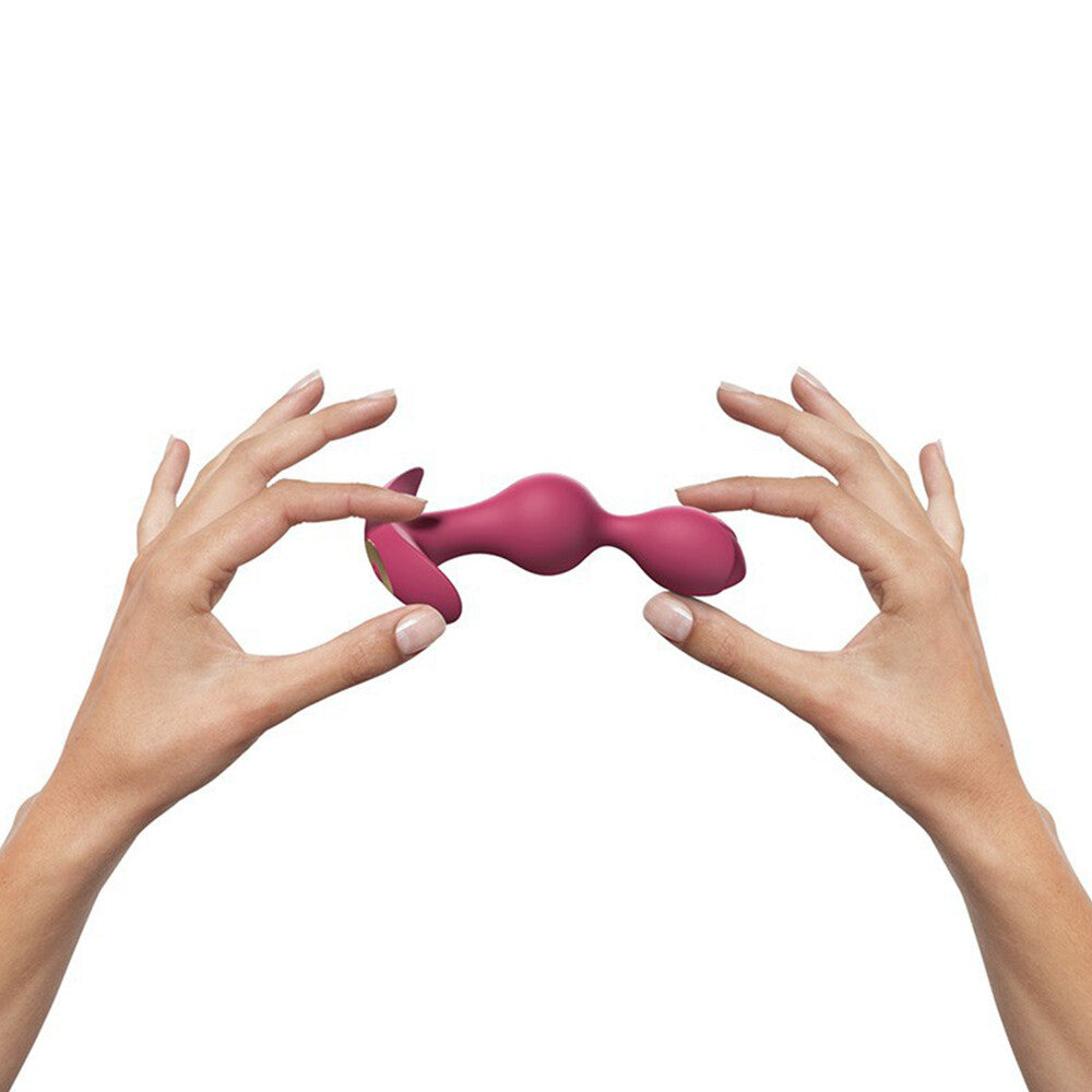 Twin vibrating butt plug with two silicone bulbs, one larger than the other, for anal play.
