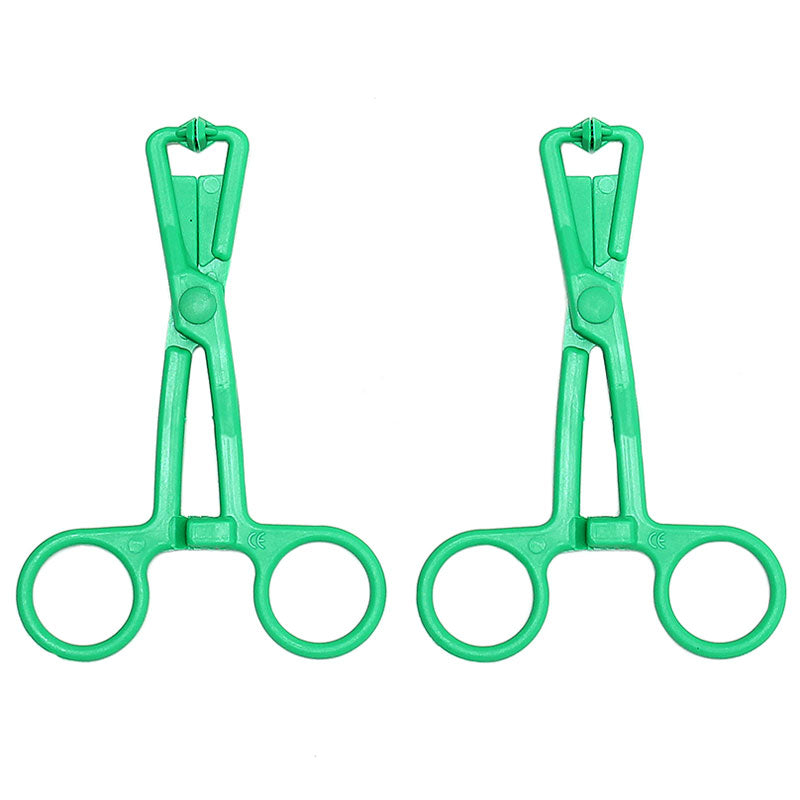 A pair of green scissor nipple clamps with a shiny metal chain, by rimba.