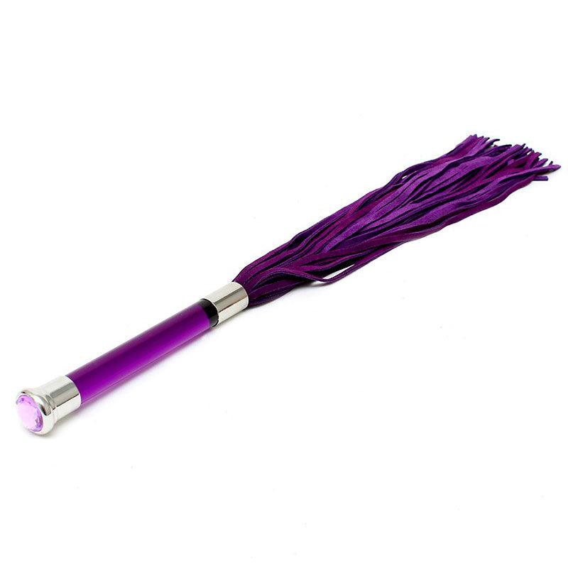 Rimba purple suede flogger with a decorative glass handle and crystal detailing.