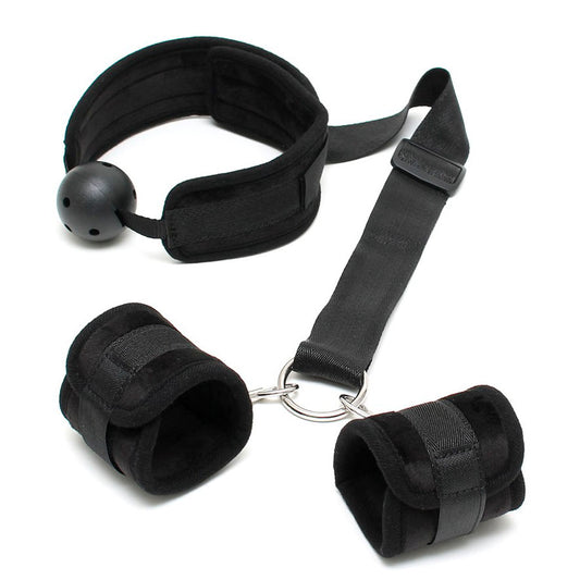 Rimba breathable mouth gag with wrist cuffs from a bondage kit, showing restraint.