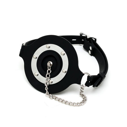 Rimba mouth gag with opening and stopper, used for controlled constraint.