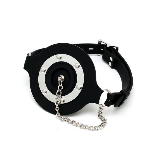 Rimba mouth gag with opening and stopper, used for controlled constraint.