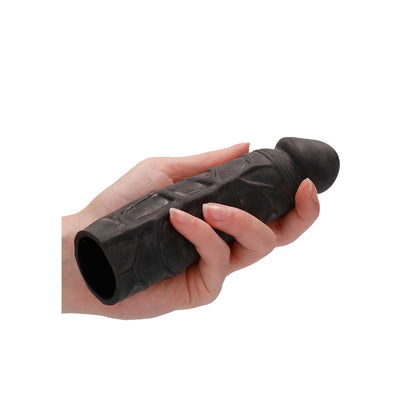 Black RealRock 7 inch penis sleeve from Shots Toys, made of flexible material.