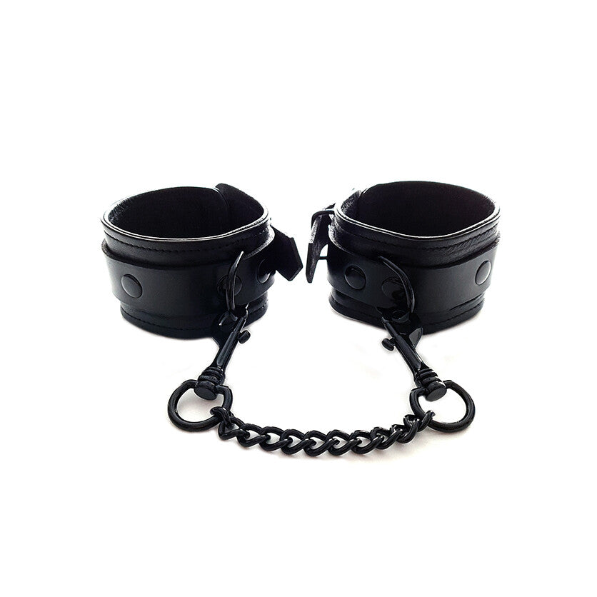 Rouge Garments plain black wrist cuffs, appearing as soft restraints made of smooth material.